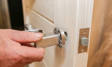 man-installing-doors-handle-repair-260nw-1377459302.jpg